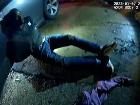 Tyre Nichols, a 29-year-old Black man who was pulled over while driving and died three days later, lays against a police car after being beaten by Memphis Police Department officers on Jan. 7, 2023, in this still image from video released by Memphis Police Department on Jan. 27, 2023.