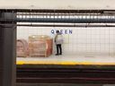 A screenshot of a man filmed while peeing on the Queen Station TTC subway platform. 