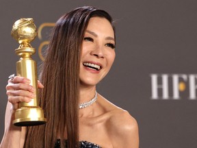 Michelle Yeoh poses with her award for Best Actress in a Musical or Comedy Motion Picture for "Everything Everywhere All at Once"  at the 80th Annual Golden Globe Awards in Beverly Hills, Calif., Jan. 10, 2023.