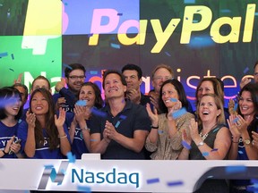 PayPal president and CEO Dan Schulman (front centre) joins employees, customers and Nasdaq employees while ringing the bell at Nasdaq July 20, 2015 in New York City as PayPal Holdings Inc. became an independent publicly-traded company on the exchange.