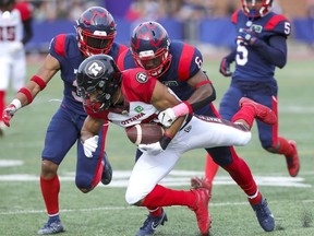 Montreal Alouettes Adarius Pickett tackles Ottawa Redblacks Nate Behar during second half of Canadian Football League game in Montreal Monday October 11, 2021.