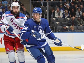 Mika Zibanejad of the New York Rangers skates against Auston Matthews of the Toronto Maple Leafs during an NHL game at Scotiabank Arena on January 25, 2023 in Toronto, Ontario, Canada.