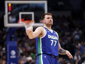 Luka Doncic of the Dallas Mavericks reacts after making a three point basket against the Minnesota Timberwolves in the second half at American Airlines Center on February 13, 2023 in Dallas, Texas.