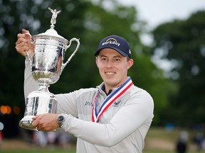 Matt Fitzpatrick of England celebrates with the US Open Championship trophy after winning the finals of the 122nd US Open Championship at The Country Club on June 19, 2022 in Brookline, Massachusetts.