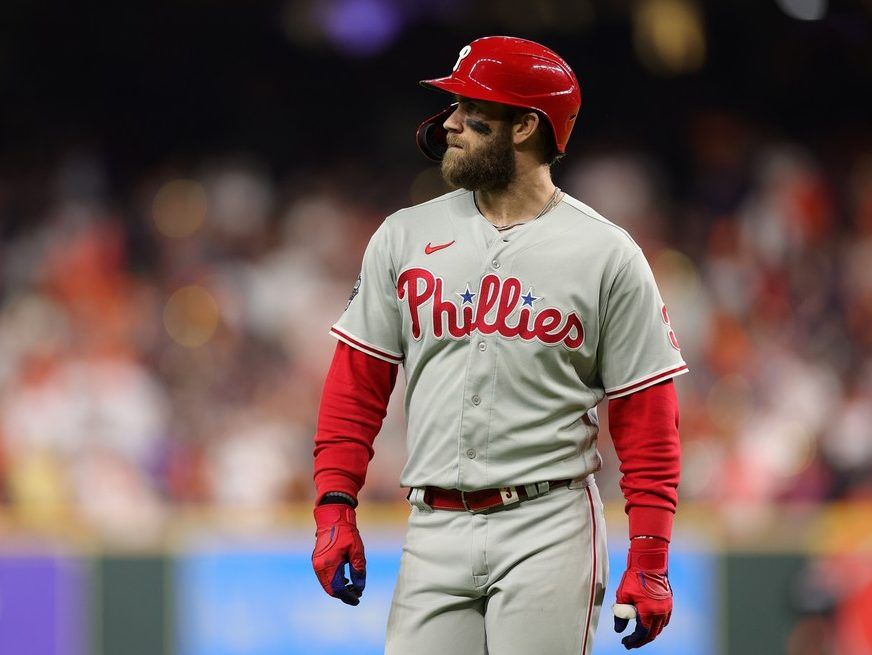 Phillies star Bryce Harper signs, gives away his own shoe to fan at airport  