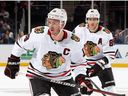 Jonathan Toews and Patrick Kane of the Chicago Blackhawks skates against the New York Islanders during the second period at the UBS Arena on December 04, 2022 in Elmont, New York.