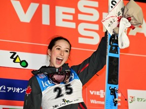 Alexandria Loutitt of Canada celebrates on the podium after winning in the women normal hill individual during the FIS Ski Jumping World Cup Zao at Aliontek Zao Schanze on January 13, 2023 in Yamagata, Japan.