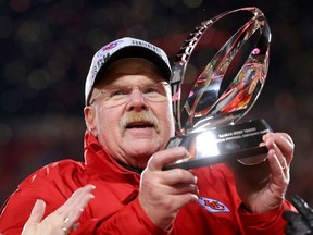 Head coach Andy Reid of the Kansas City Chiefs holds up the Lamar Hunt Trophy after defeating the Cincinnati Bengals 23-20 in the AFC Championship Game at GEHA Field at Arrowhead Stadium on January 29, 2023 in Kansas City, Missouri.