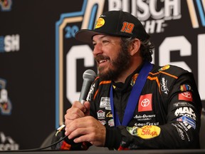 Martin Truex Jr., driver of the #19 Bass Pro Shops Toyota, speaks to the media after wining the NASCAR Clash at the Coliseum at Los Angeles Memorial Coliseum on February 5, 2023 in Los Angeles.