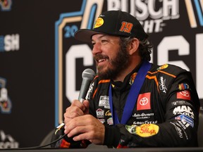 Martin Truex Jr., driver of the #19 Bass Pro Shops Toyota, speaks to the media  after wining the NASCAR Clash at the Coliseum at Los Angeles Memorial Coliseum on February 5, 2023 in Los Angeles.