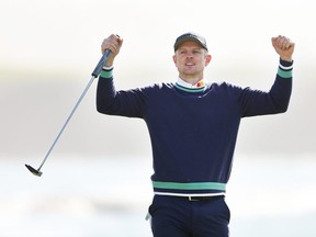 Justin Rose of England celebrates winning on the 18th green during the continuation of the final round of the AT&T Pebble Beach Pro-Am at Pebble Beach Golf Links on February 06, 2023 in Pebble Beach, California.