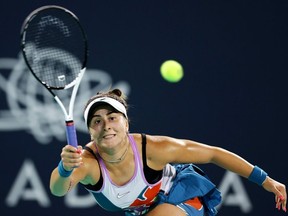 Bianca Andreescu of Canada plays a forehand against Yulia Putintseva of Kazakstan during her Women's Singles match on Day 2 of the Mubadala Abu Dhabi Open, part of the Hologic WTA Tour, at Zayed Sports City on February 07, 2023 in Abu Dhabi, United Arab Emirates.