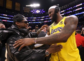 LeBron James #6 of the Los Angeles Lakers celebrates with musician Usher at the end of the game after passing Kareem Abdul-Jabbar to become the NBA’s all-time leading scorer, surpassing Abdul-Jabbar’s career total of 38,387 points against the Oklahoma City Thunder at Crypto.com Arena on February 07, 2023 in Los Angeles, California. (Photo by Harry How/Getty Images)