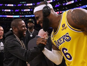 LeBron James #6 of the Los Angeles Lakers celebrates with boxer Floyd Mayweather Jr. at the end of the game after passing Kareem Abdul-Jabbar to become the NBA’s all-time leading scorer, surpassing Abdul-Jabbar’s career total of 38,387 points against the Oklahoma City Thunder at Crypto.com Arena on February 07, 2023 in Los Angeles, California. (Photo by Harry How/Getty Images)