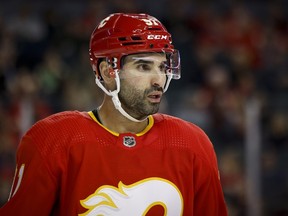 Nazem Kadri of the Calgary Flames during a break in play against the Detroit Red Wings at the Scotiabank Saddledome on February 16, 2022, in Calgary, Alberta, Canada.