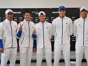 (L-R) South Korea's tennis team captain Park Seung-kyu, players Song Min-kyu, Nam Ji-sung, Hong Seong-chan and Kwon Soon-woo pose for a photo during the official draw of the Davis Cup qualifiers first round between South Korea and Belgium in Seoul on February 3, 2023.