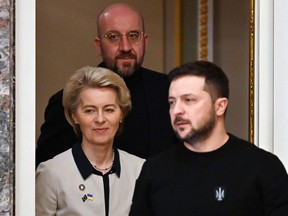 Ukrainian President Volodymyr Zelenskyy (right), President of the European Commission Ursula von der Leyen (left) and European Council President Charles Michel (centre) arrive for a joint press conference during an EU-Ukraine summit in Kyiv on Feb. 3, 2023.