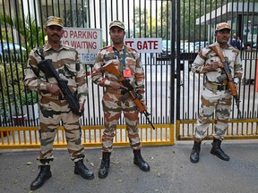 Indo-Tibetan Border Police stand guard outside the office building where Indian tax authorities raided BBC's office in New Delhi on February 15, 2023, following a protest against the BBC by Hindu Sena activists, an Indian right-wing organization. (Photo by SAJJAD HUSSAIN/AFP via Getty Images)