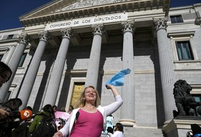 Spain approves menstrual leave, teen abortion and trans laws Spain’s LGTBI+ member Niurka Gibaja celebrates in front of the Spanish Congress, in Madrid on Feb. 16, 2023 after the ‘transgender ley’ was voted.