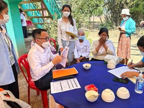 This picture released by Cambodia's Communicable Disease Control Department (CDCD) on February 23, 2023, shows CDCD experts educating villagers of H5N1 virus threats, in Prey Veng province. - (Photo by HANDOUT/Cambodia's Communicable Disease /AFP via Getty Images)
