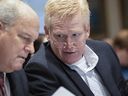 Alex Murdaugh, right, leans over to talk with his attorney Jim Griffin in his double murder trial at the Colleton County Courthouse in Walterboro, S.C., Friday, Feb. 3, 2023. 