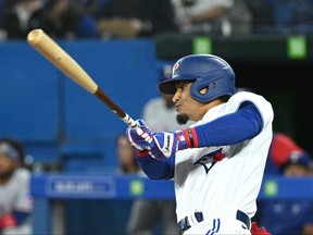 Toronto Blue Jays second baseman Santiago Espinal hits a run scoring double against the Texas Rangers in the sixth inning at Rogers Centre.