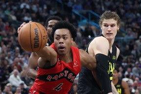 Toronto Raptors forward Scottie Barnes (4) and Utah Jazz forward Lauri Markkanen (right) play for a loose ball in the second quarter at Vivint Arena Feb 1, 2023; Salt Lake City, Utah. Rob Gray-USA TODAY Sports