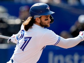 Blue Jays’ Bo Bichette hits a single during a game against the Tampa Bay Rays in Toronto, Thursday, Sept. 15, 2022.