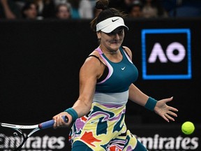 Bianca Andreescu returns to Cristina Bucsa during their women's singles match at the Australian Open in Melbourne, Jan. 18, 2023.