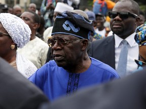 Presidential candidate Bola Ahmed Tinubu arrives at a polling station before casting his ballot in Ikeja, Lagos, Nigeria, Feb. 25, 2023.