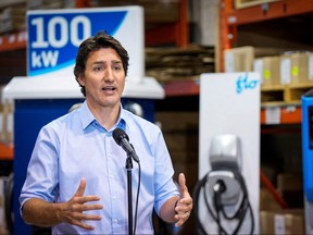 Prime Minister Justin Trudeau speaks during a news conference at a production facility of electric vehicle charger manufacturer Flo in Shawinigan, Que., Jan. 18, 2023.