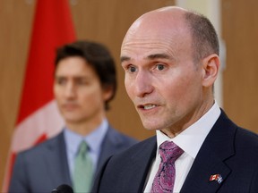 Canada's Minister of Health Jean-Yves Duclos, with Prime Minister Justin Trudeau, takes part in a news conference after touring a medical training facility in Ottawa, Feb. 7, 2023.