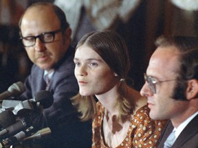 In this Aug. 19, 1970, file photo, Linda Kasabian speaks at a news conference she held at end of her 18 days on stand as a prosecution witness in the Manson Family murder trials in Los Angeles. Attorneys are Roland Goldman at her left, and Gary Fleischman at her right.