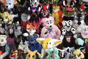 Furries pose for the annual Fursuit Group Photo at the Anthrocon Convention at David L. Lawrence Convention Center on Saturday, June 2, 2022, in downtown Pittsburgh. (Maya Giron/Pittsburgh Post-Gazette via AP)