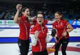 Kerri Einarson and her teammates celebrate after winning their fourth straight Canadian women's curling championship on Sunday.