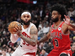 Raptors' Gary Trent Jr. (left) protects the ball from Chicago Bulls' Coby White during the second half in Toronto, on Tuesday, February 28, 2023.