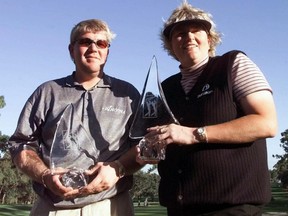 JCPenney Classic champions John Daly of Rogers Ark., and Laura Davies of England hold their trophy Sunday afternoon, Dec. 5, 1999, at the Westin Innisbrook Resort in Palm Harbor, Fla. The pair defeated Paul Azinger and Se Ri Pak on the third playoff hole.
