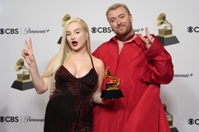 Kim Petras, left, and Sam Smith, winners of the award for Best Pop Duo/Group Performance for “Unholy,” pose in the press room at the 65th annual Grammy Awards on Sunday, Feb. 5, 2023.