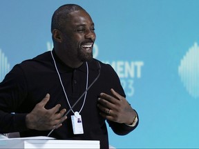 British actor Idris Elba speaks during the World Government Summit in Dubai, United Arab Emirates, Tuesday, Feb. 14, 2023. While on stage, Elba brought up the persistent discussions about him taking over as Ian Fleming's famed British spy 007.
