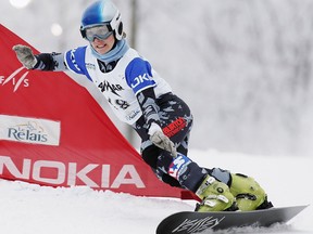 USA's Rosey Fletcher races the women's PGS to a seventh place finish at the Nokia snowboard world cup Sunday Dec 18, 2005 in Lac Beauport Que.