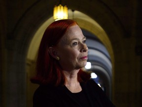 Catherine Tait, looks on as then-Heritage Minister Melanie Joly, not shown, announces that Tait is the new president and CEO of CBC/Radio-Canada during a press conference in the foyer of the House of Commons on Parliament Hill in Ottawa on April 3, 2018.