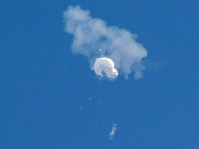 The suspected Chinese spy balloon drifts to the Atlantic Ocean after being shot down off the coast in Surfside Beach, South Carolina, Saturday, Feb. 4, 2023.