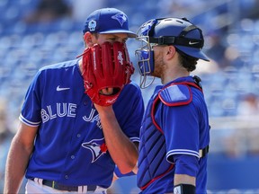 Toronto Blue Jays starting pitcher Chris Bassitt (40) and catcher Danny Jansen (9) conference at the mound during the first inning against the Detroit Tigers at TD Ballpark on Tuesday.