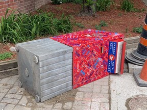 An overturned Canada Post mailbox at the corner of Church and Gloucester Sts. in Toronto on May 26, 2021.