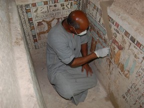 An Egyptian employee works at the 4,000-year-old tomb of Meru, the oldest site accessible to the public on Luxor's West Bank February 9, 2023.