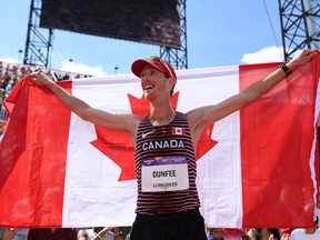 Evan Dunfee of Team Canada celebrates his gold medal in the men's 10,000-metre race walk at the Birmingham 2022 Commonwealth Games at Alexander Stadium on August 7, 2022 on the Birmingham, England.