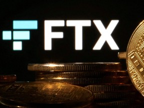 Representations of cryptocurrencies are seen in front of a displayed FTX logo in this illustration taken Nov. 10, 2022.