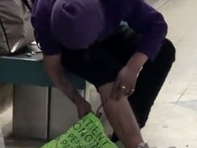 A screengrab from video of a man attempting to inject drugs on a TTC subway platform this week.