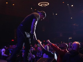 The Undertaker greets fans on stage during his 1deadMan Show in Montreal on Thursday night. (SCREENSHOT/Twitter/undertaker)