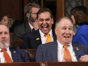 Rep. George Santos (R-NY) (centre) laughs before U.S. President Joe Biden delivers the State of the Union address to a joint session of Congress on Feb. 7, 2023 in the House Chamber of the U.S. Capitol in Washington, D.C.